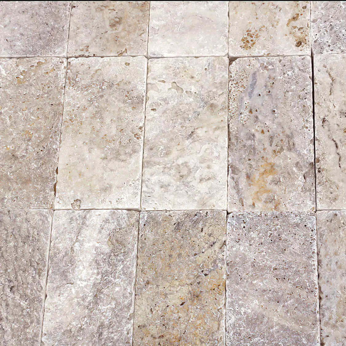 Pavé travertin mix Vieilli, brut.
beige clair au marron doux
Bords droits
Longueur : 20x10x5 cm